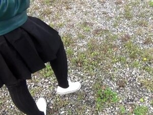 Schoolgirl In Black Knee Socks And White Shoes Show Under The Skirt