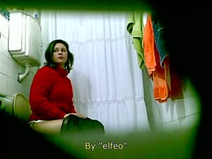 Pretty Brunette MILF Peeing On The Spy Camera In A Toilet