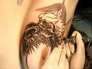 Tattooing Dragon Head On Tit !!!