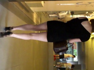 Upskirt - Girl In Tight Miniskirt And Leopard Pump