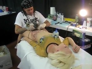 Blonde Bimbo Moans With Pain As Her Pubis Was Being Tattooed